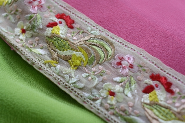 Margha ni kor. This is a hand-made antique border showing the domesticated fowl. The border is attached on a georgette saree.