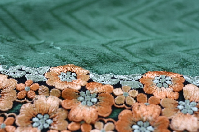 This is an antique border attached to an antique silk leno or damask saree. The saree is covered with a self-weave depicting the swastika. 