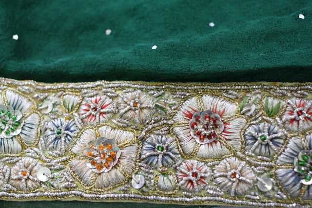 This is an antique border made using pure gold and silver wire. The border alone weighs three kilograms. It is attached to a georgette saree.