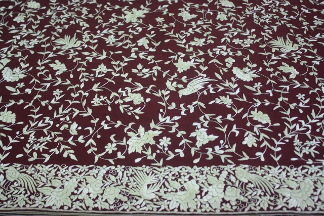 A new Gara on maroon crepe silk. The work on the body is dense, the border even denser.