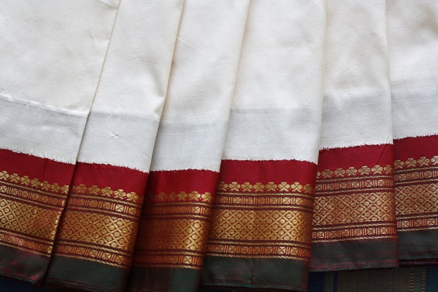 A pure white Kanjeevaram silk with a two-tone border. A classic.