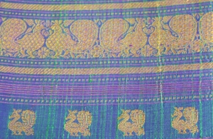 Traditional peacock motifs on the elaborate pallu of  a Kanjeevaram silk saree